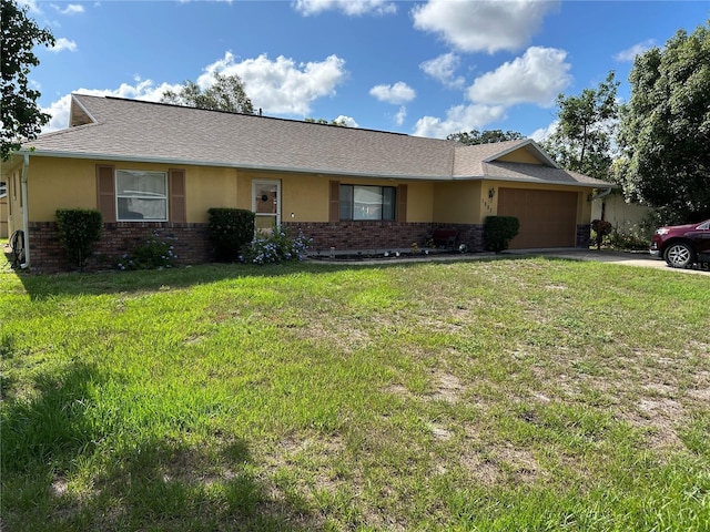 1887 Viking Ave, Deltona, FL 32725 - single story home featuring driveway, an attached garage, brick siding, and a front lawn
