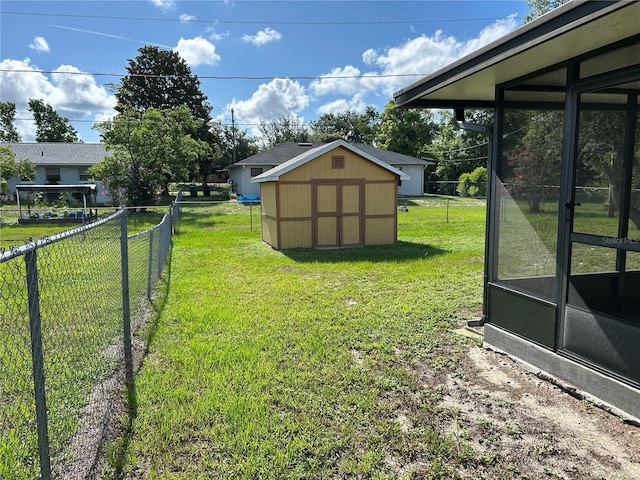 1887 Viking Ave, Deltona, FL 32725 - view of yard with a storage shed and a sunroom