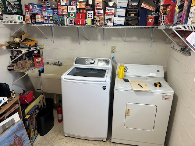 1887 Viking Ave, Deltona, FL 32725 - washroom with washing machine and clothes dryer and concrete block wall