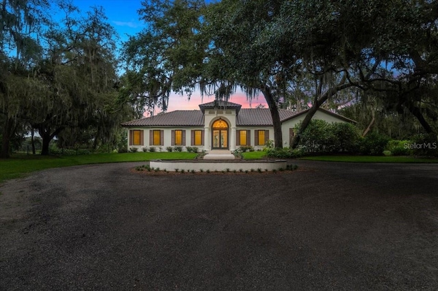 4885 State Road 11, De Leon Springs, FL 32130 - mediterranean / spanish-style home with a tiled roof, driveway, and stucco siding