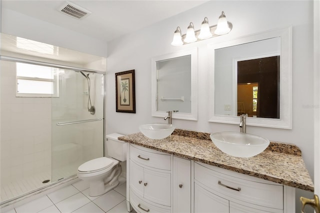 5 Bird Of Paradise Pl, Palm Coast, FL 32137 - bathroom with a stall shower, double vanity, and tile patterned flooring