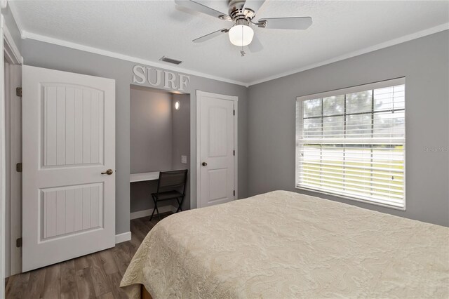 5 Bird Of Paradise Pl, Palm Coast, FL 32137 - bedroom featuring dark wood finished floors, ornamental molding, and a ceiling fan