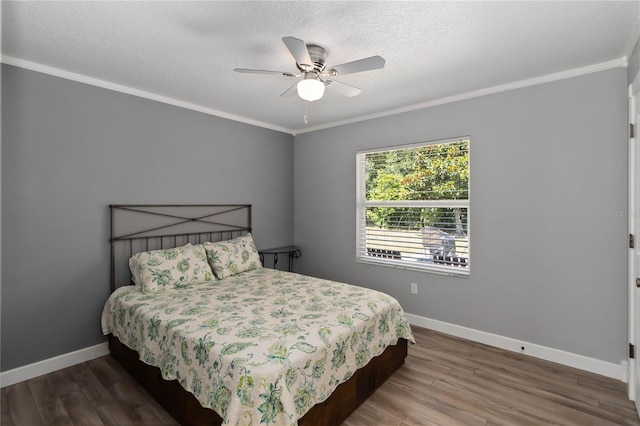 5 Bird Of Paradise Pl, Palm Coast, FL 32137 - bedroom with wood finished floors, crown molding, a textured ceiling, and ceiling fan
