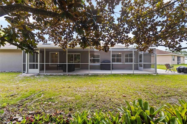 5 Bird Of Paradise Pl, Palm Coast, FL 32137 - back of house with a patio area, a yard, a sunroom, and stucco siding