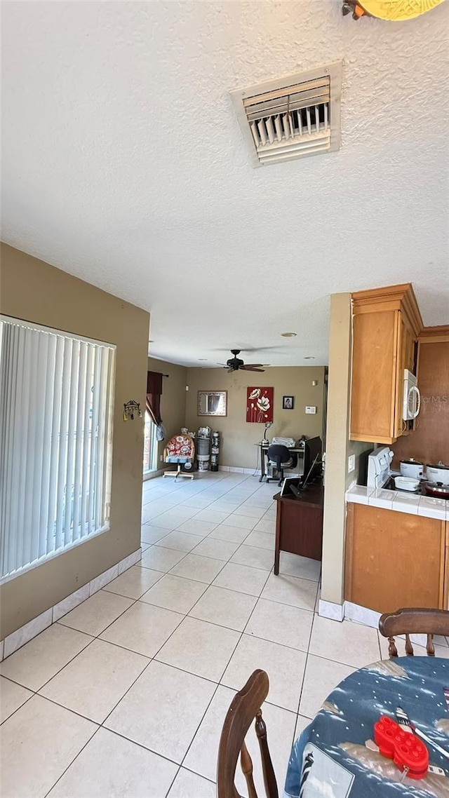 1025 Persian St, Deltona, FL 32725 - hallway with light tile patterned floors