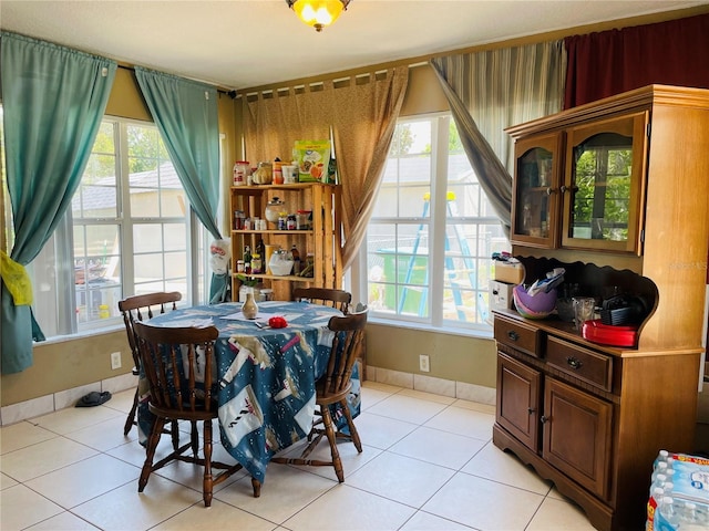 1025 Persian St, Deltona, FL 32725 - dining area featuring light tile patterned floors and baseboards