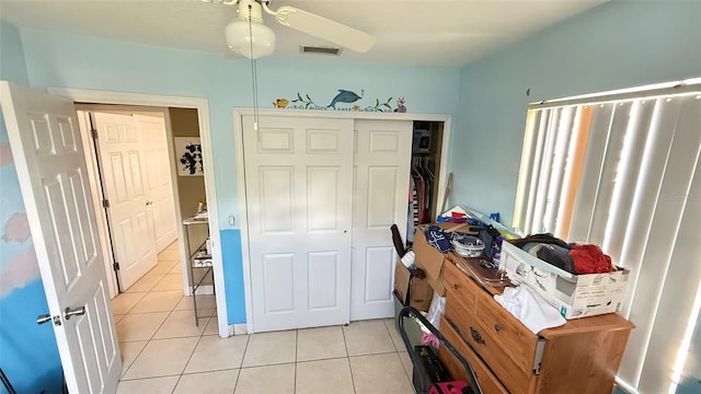 1025 Persian St, Deltona, FL 32725 - bedroom featuring light tile patterned flooring and a closet