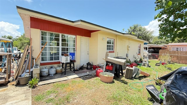 1025 Persian St, Deltona, FL 32725 - rear view of property with concrete block siding
