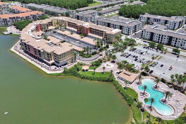 424 Luna Bella Ln Unit 330, New Smyrna Beach, FL 32168 - aerial view of property and surrounding area featuring a pool area and a nearby body of water