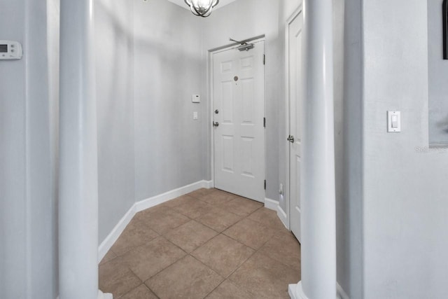 424 Luna Bella Ln Unit 330, New Smyrna Beach, FL 32168 - hall featuring light tile patterned floors and baseboards
