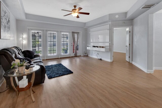 424 Luna Bella Ln Unit 330, New Smyrna Beach, FL 32168 - living room featuring wood finished floors and ceiling fan