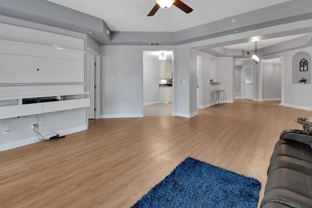 424 Luna Bella Ln Unit 330, New Smyrna Beach, FL 32168 - unfurnished living room featuring ceiling fan and light wood-style flooring