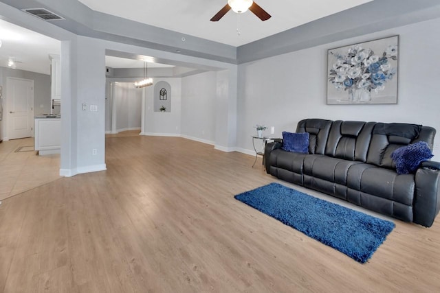 424 Luna Bella Ln Unit 330, New Smyrna Beach, FL 32168 - living room featuring a ceiling fan and light wood-type flooring