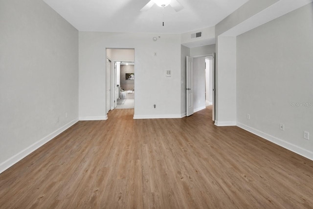 424 Luna Bella Ln Unit 330, New Smyrna Beach, FL 32168 - empty room with a ceiling fan and wood finished floors