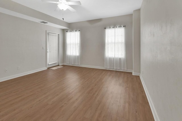 424 Luna Bella Ln Unit 330, New Smyrna Beach, FL 32168 - unfurnished room with healthy amount of natural light, a ceiling fan, and light wood-style floors