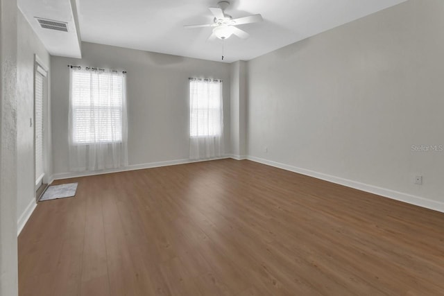 424 Luna Bella Ln Unit 330, New Smyrna Beach, FL 32168 - spare room featuring wood finished floors and a ceiling fan