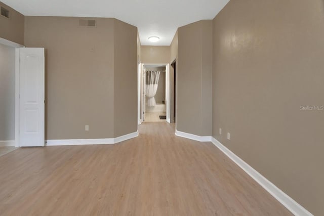 424 Luna Bella Ln Unit 330, New Smyrna Beach, FL 32168 - unfurnished room featuring light wood-style floors and baseboards