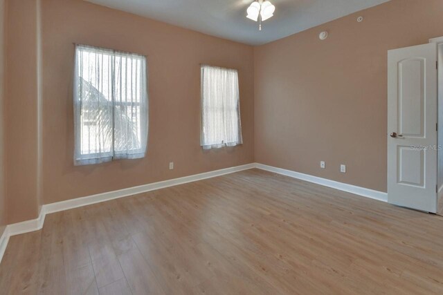 424 Luna Bella Ln Unit 330, New Smyrna Beach, FL 32168 - empty room with plenty of natural light and light wood-type flooring