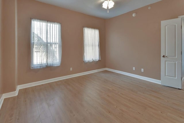 424 Luna Bella Ln Unit 330, New Smyrna Beach, FL 32168 - empty room with plenty of natural light and light wood-type flooring