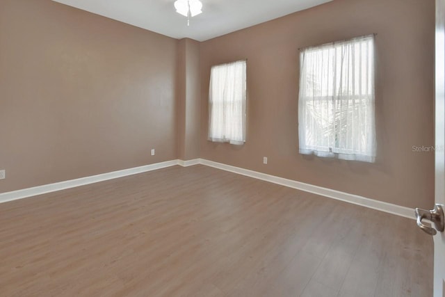 424 Luna Bella Ln Unit 330, New Smyrna Beach, FL 32168 - spare room with wood finished floors and baseboards