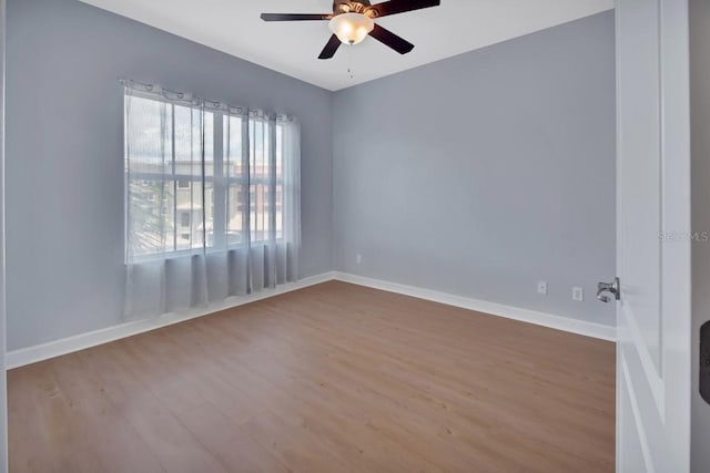 424 Luna Bella Ln Unit 330, New Smyrna Beach, FL 32168 - spare room with wood finished floors and a ceiling fan