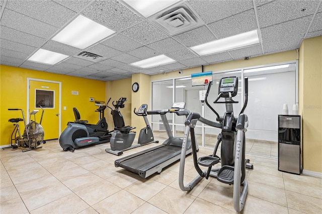 2545 S Atlantic Ave Unit 102, Daytona Beach Shores, FL 32118 - workout area featuring a drop ceiling and light tile patterned flooring