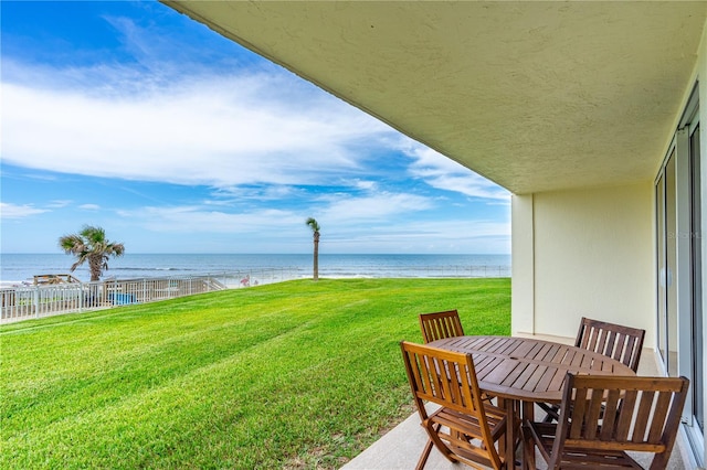 2545 S Atlantic Ave Unit 102, Daytona Beach Shores, FL 32118 - view of yard featuring a water view and outdoor dining area