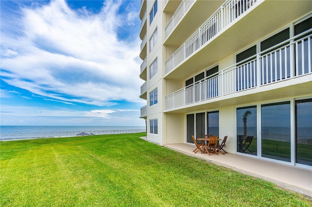 2545 S Atlantic Ave Unit 102, Daytona Beach Shores, FL 32118 - view of grassy yard featuring a water view