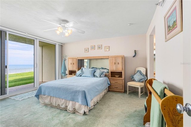 2545 S Atlantic Ave Unit 102, Daytona Beach Shores, FL 32118 - carpeted bedroom featuring access to exterior, a water view, and ceiling fan