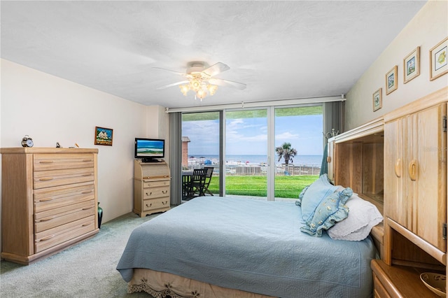 2545 S Atlantic Ave Unit 102, Daytona Beach Shores, FL 32118 - carpeted bedroom with access to exterior and ceiling fan
