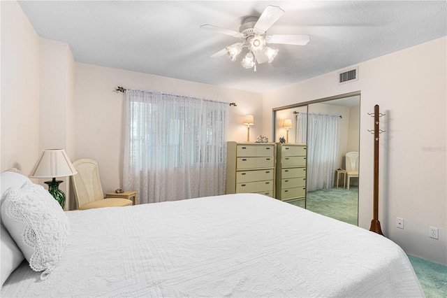 2545 S Atlantic Ave Unit 102, Daytona Beach Shores, FL 32118 - carpeted bedroom featuring a closet and a ceiling fan