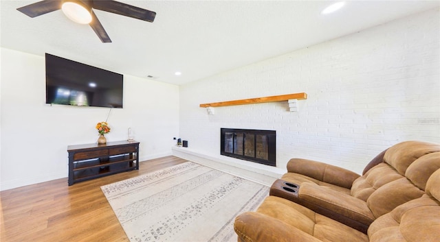 2526 Victory Palm Dr, Edgewater, FL 32141 - living room featuring light wood finished floors, a ceiling fan, a brick fireplace, and recessed lighting