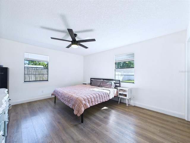 2526 Victory Palm Dr, Edgewater, FL 32141 - bedroom featuring multiple windows, wood finished floors, a textured ceiling, ceiling fan, and heating unit