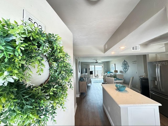 2860 Ocean Shore Blvd Unit 5020, Ormond Beach, FL 32176 - kitchen featuring stainless steel fridge with ice dispenser, a center island, dark wood finished floors, light stone counters, and recessed lighting