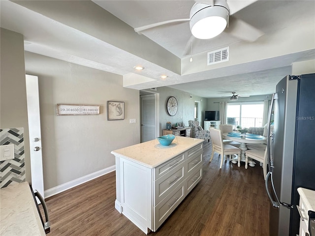 2860 Ocean Shore Blvd Unit 5020, Ormond Beach, FL 32176 - kitchen with freestanding refrigerator, a ceiling fan, open floor plan, dark wood-type flooring, and a kitchen island
