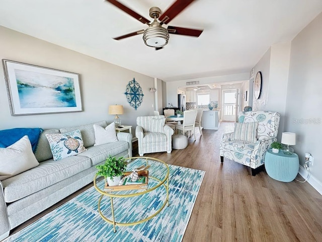 2860 Ocean Shore Blvd Unit 5020, Ormond Beach, FL 32176 - living area with wood finished floors and a ceiling fan