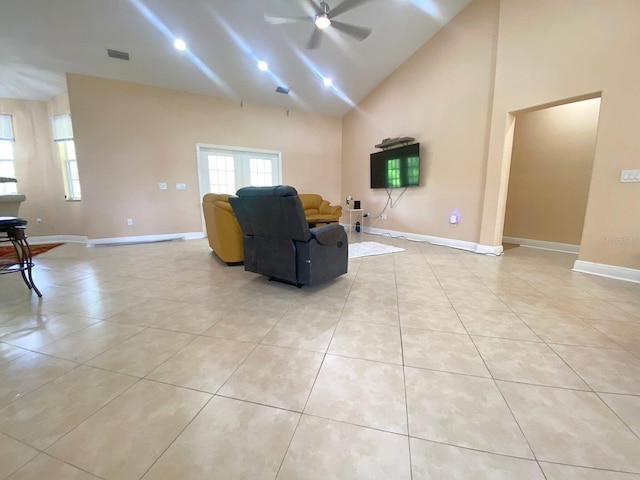 19320 Oberly Pkwy, Orlando, FL 32833 - living room featuring a ceiling fan, light tile patterned flooring, and high vaulted ceiling