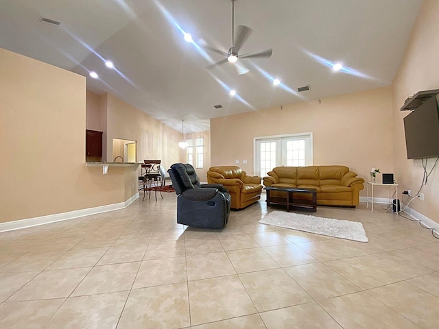 19320 Oberly Pkwy, Orlando, FL 32833 - living room with a ceiling fan, light tile patterned floors, and high vaulted ceiling
