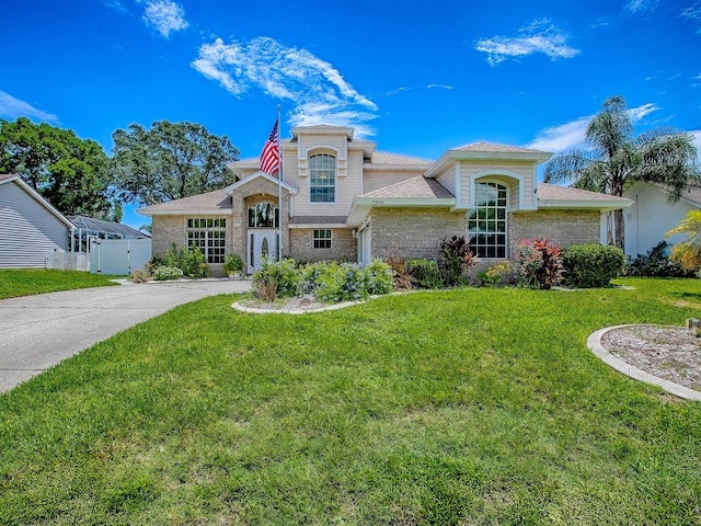 5936 Boggs Ford Rd, Port Orange, FL 32127 - view of front of home featuring stone siding, driveway, and brick siding
