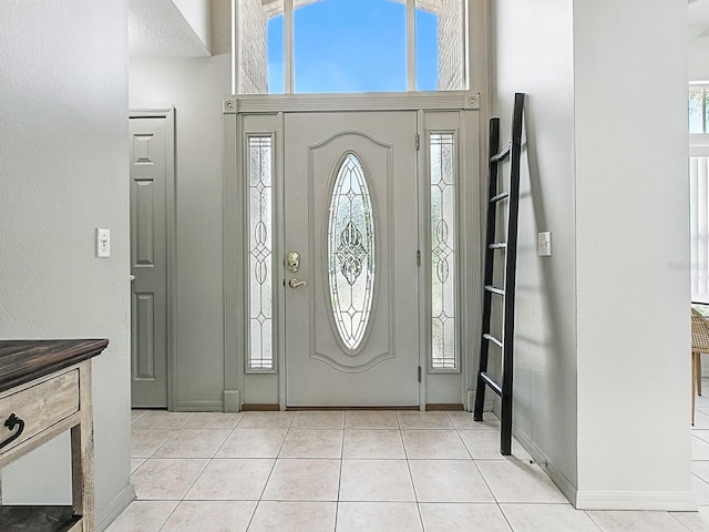 5936 Boggs Ford Rd, Port Orange, FL 32127 - entrance foyer featuring a towering ceiling and light tile patterned floors