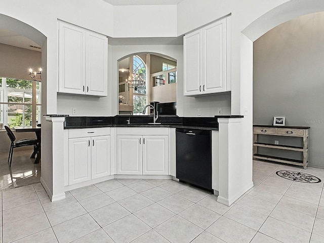 5936 Boggs Ford Rd, Port Orange, FL 32127 - kitchen with dishwasher, light tile patterned floors, dark countertops, and white cabinets