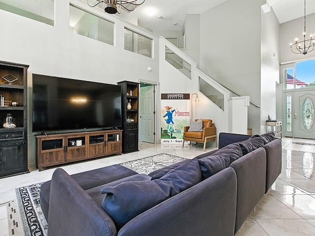 5936 Boggs Ford Rd, Port Orange, FL 32127 - living area with a chandelier, marble tiled floors, a high ceiling, and stairs