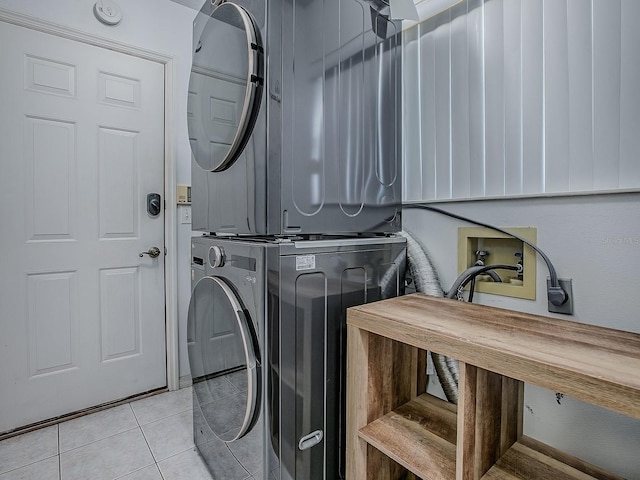 5936 Boggs Ford Rd, Port Orange, FL 32127 - washroom with stacked washer / drying machine and tile patterned floors