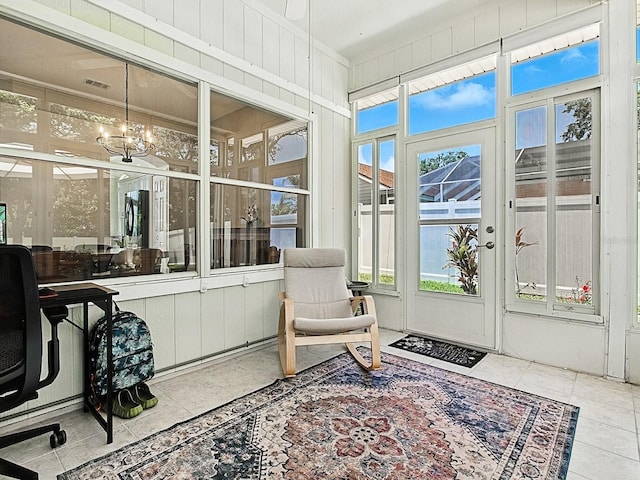5936 Boggs Ford Rd, Port Orange, FL 32127 - sunroom with a chandelier