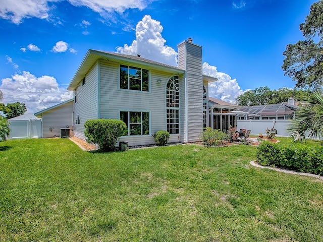 5936 Boggs Ford Rd, Port Orange, FL 32127 - rear view of property featuring a chimney