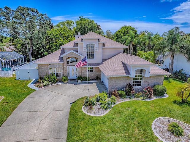 5936 Boggs Ford Rd, Port Orange, FL 32127 - view of front facade with brick siding, concrete driveway, a gate, and roof with shingles