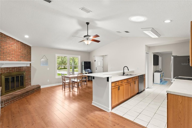 2455 Whooping Crane Dr, De Leon Springs, FL 32130 - kitchen featuring stainless steel appliances, a ceiling fan, light countertops, vaulted ceiling, and light wood-type flooring