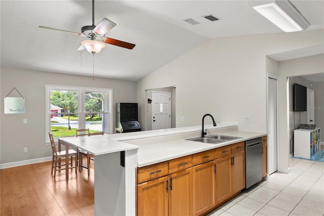 2455 Whooping Crane Dr, De Leon Springs, FL 32130 - kitchen featuring dishwasher, a peninsula, lofted ceiling, light countertops, and a ceiling fan
