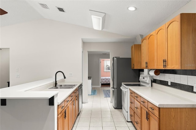 2455 Whooping Crane Dr, De Leon Springs, FL 32130 - kitchen with white electric stove, lofted ceiling, light tile patterned floors, light countertops, and dishwasher