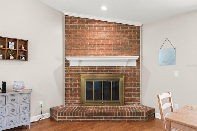 2455 Whooping Crane Dr, De Leon Springs, FL 32130 - living room with a brick fireplace and wood finished floors